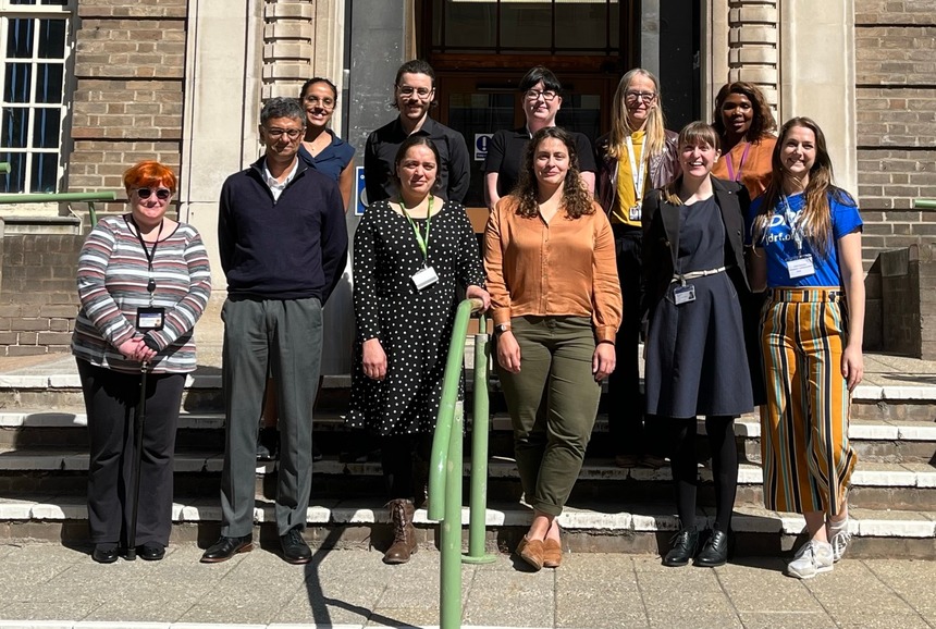 A photo of the ELSA study team standing on steps outside a building with a member of staff from Breakthrough T1D.