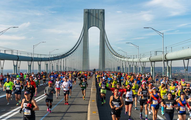 New York City marathon runners on bridge