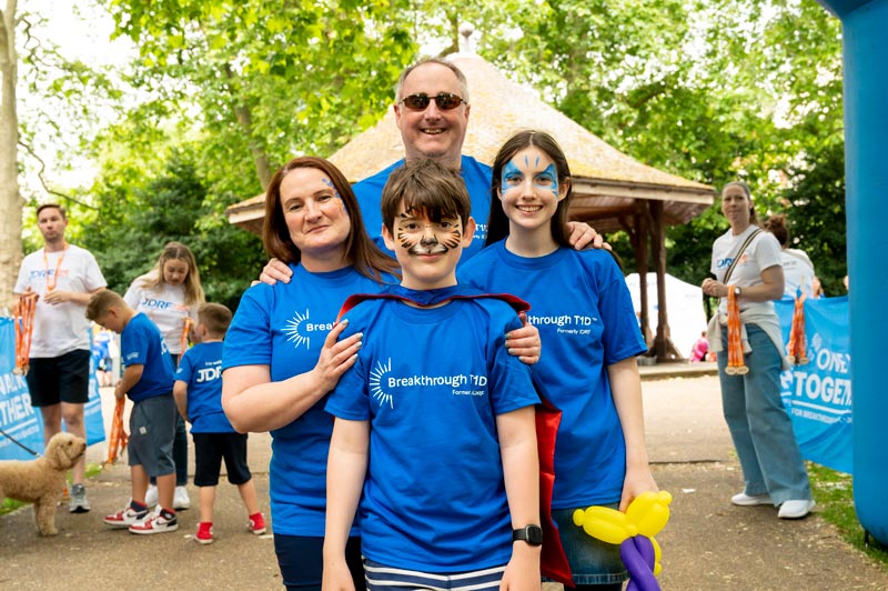 One Walk family at finish line in Breakthrough T1D shirts walking to support type 1 diabetes research