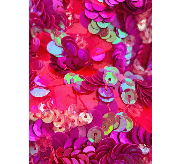 A close up of the bright pink sequin detailing on Megan Neville's evening bag for her project, Ordinary Oddness