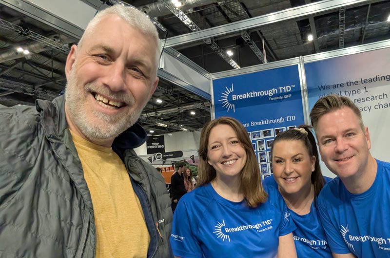 Bob Wilkinson, Community Connector volunteer, with Breakthrough T1D staff at an exhibition