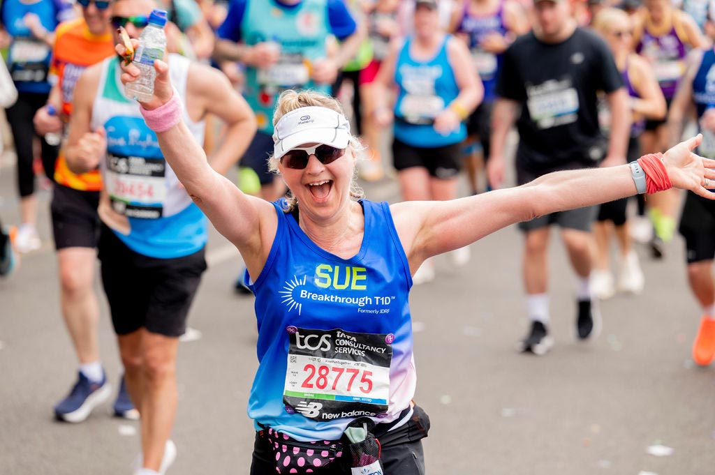 Happy runner Sue in the London Marathon 2025 running for Breakthrough T1D to raise money for type 1 diabetes.