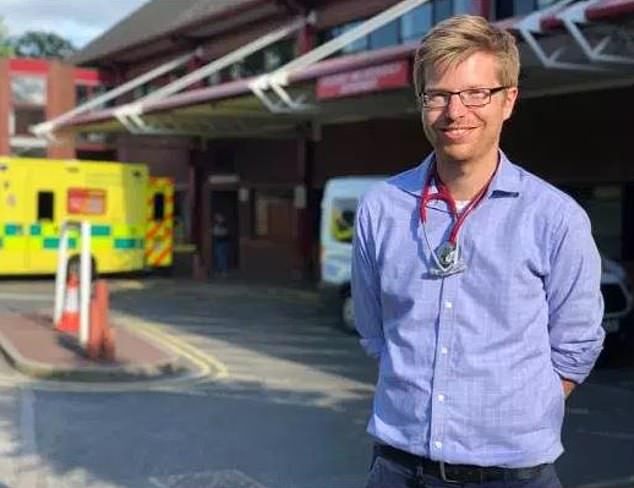Jonathan Golding, a researcher standing in front of a hospital