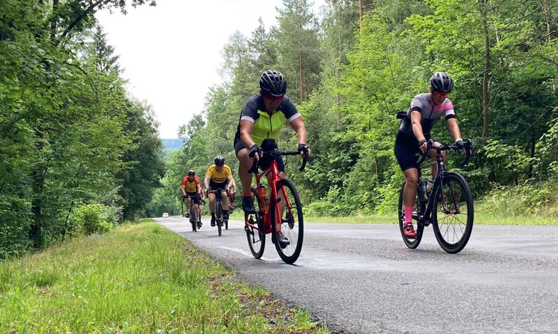 Cyclists on country road in Vienna to Prague Cycle ride event.