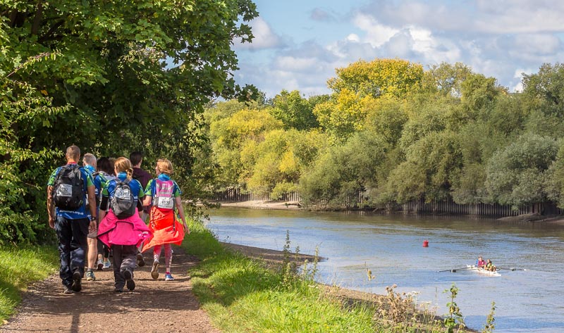 Walkers on the Thames Path by the river on the Windsor 50 Ultra Challenge.