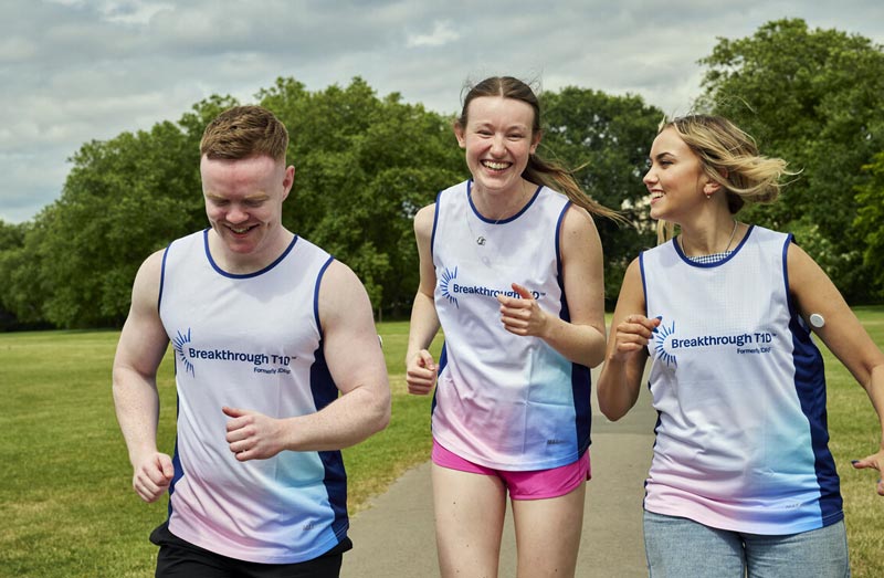 Three young people running in park in Breakthrough T1D vests