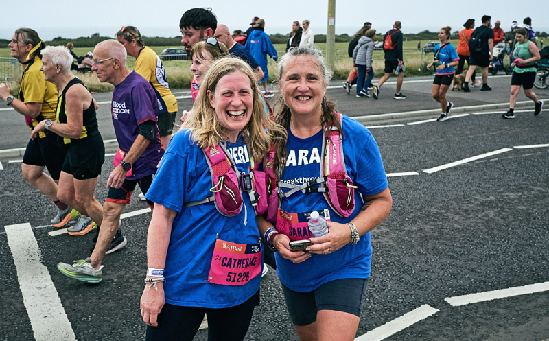 Two female Breakthrough TD1 charity marathon runners smiling