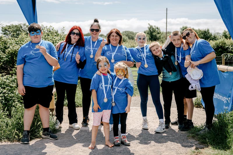 BreakthroughT1D One Walk walkers group with medals around necks