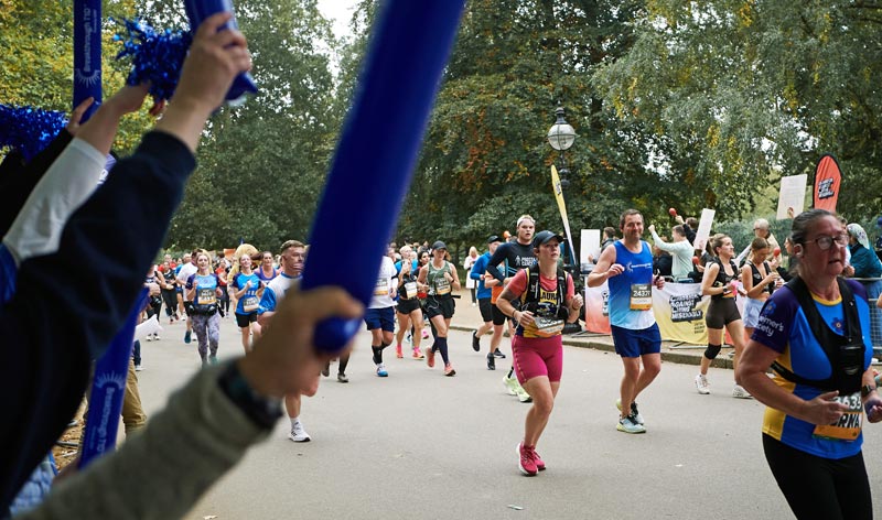 Cheer squad and half marathon runners in the park
