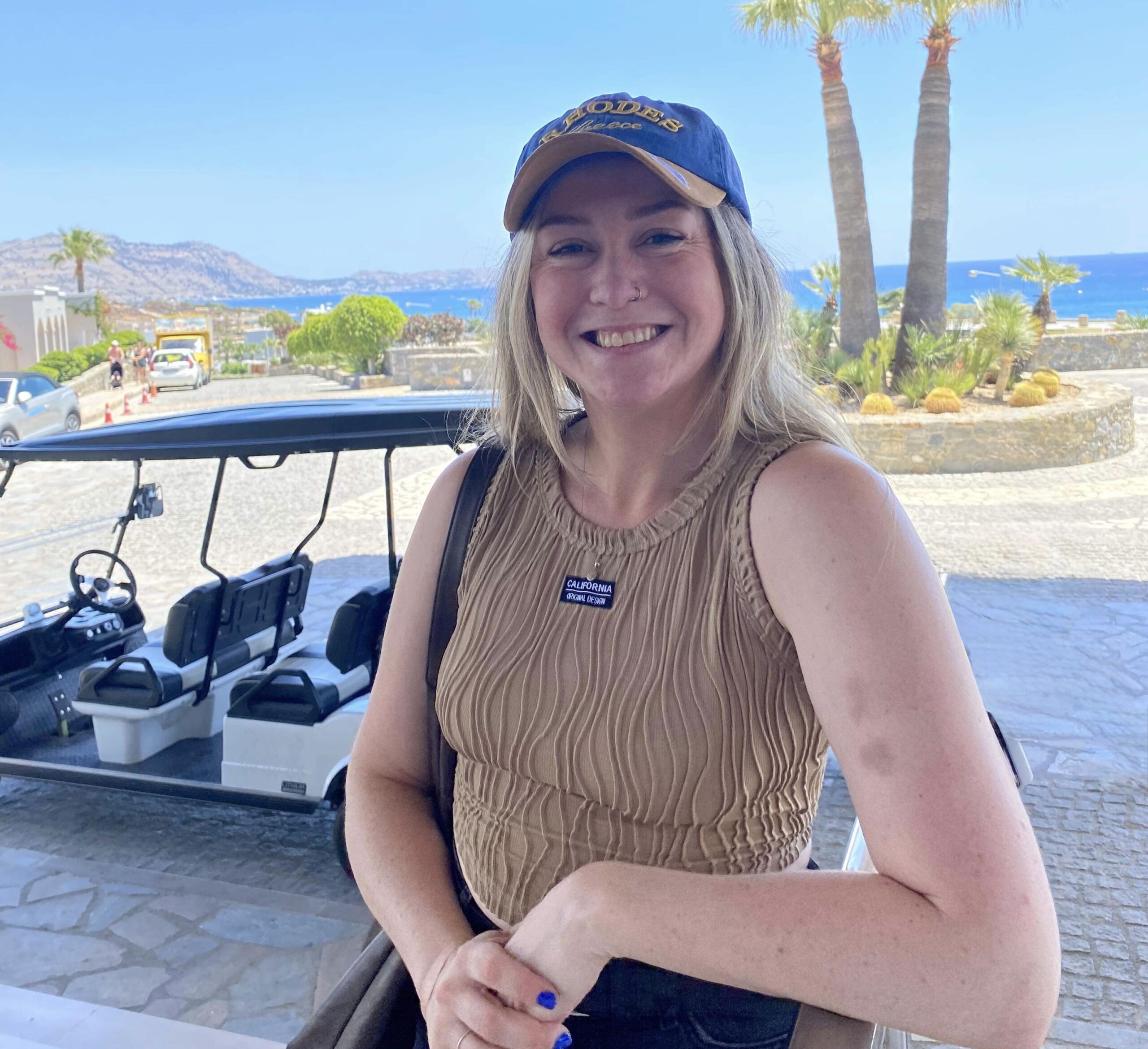 Girl smiling with insulin pump on left arm