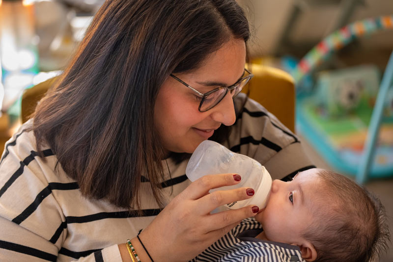 Manisha feeding baby Dillan