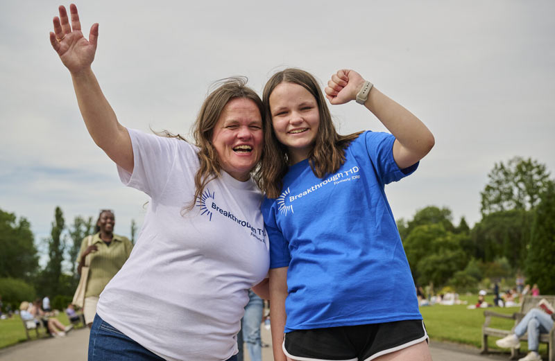 Two women in park celebrating in Breakthrough T1D shirts